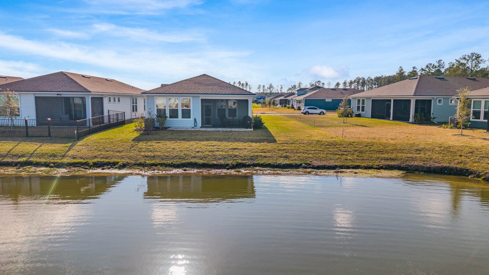 727 Cool Breeze Way Yulee, FL 32097 - Photo 24 of 31 a view of a house with swimming pool and a yard