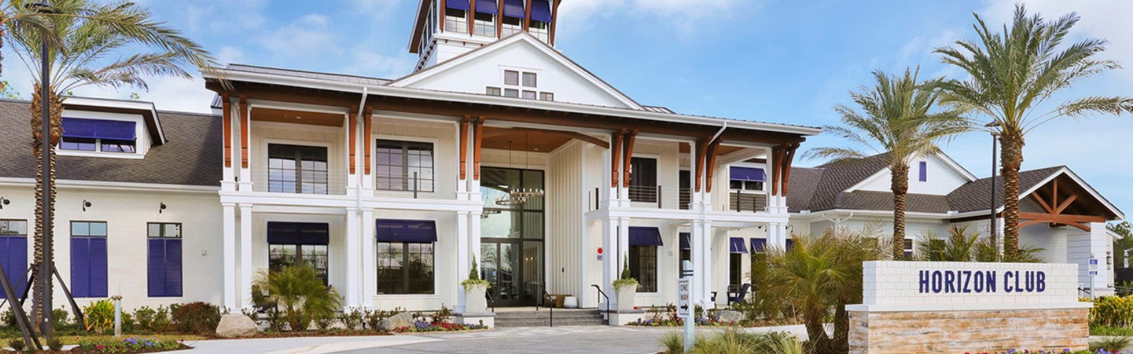 727 Cool Breeze Way Yulee, FL 32097 - Photo 28 of 31 a view of a white building with large windows