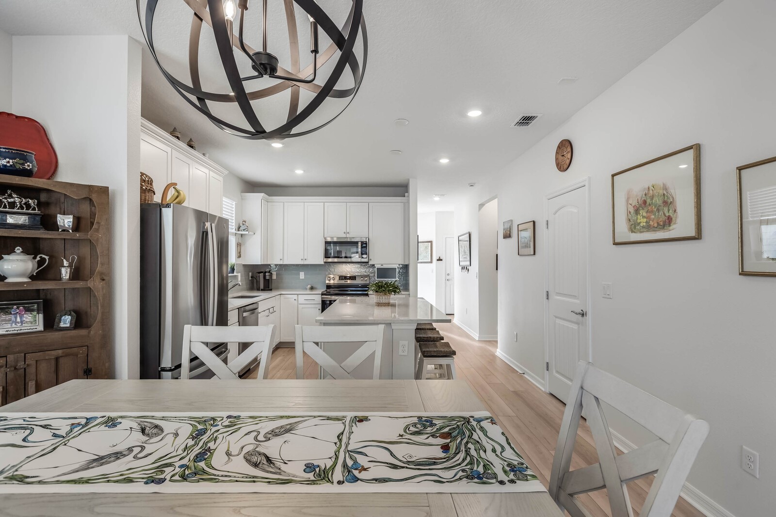 727 Cool Breeze Way Yulee, FL 32097 - Photo 6 of 31 a living room with stainless steel appliances kitchen island granite countertop furniture and a rug
