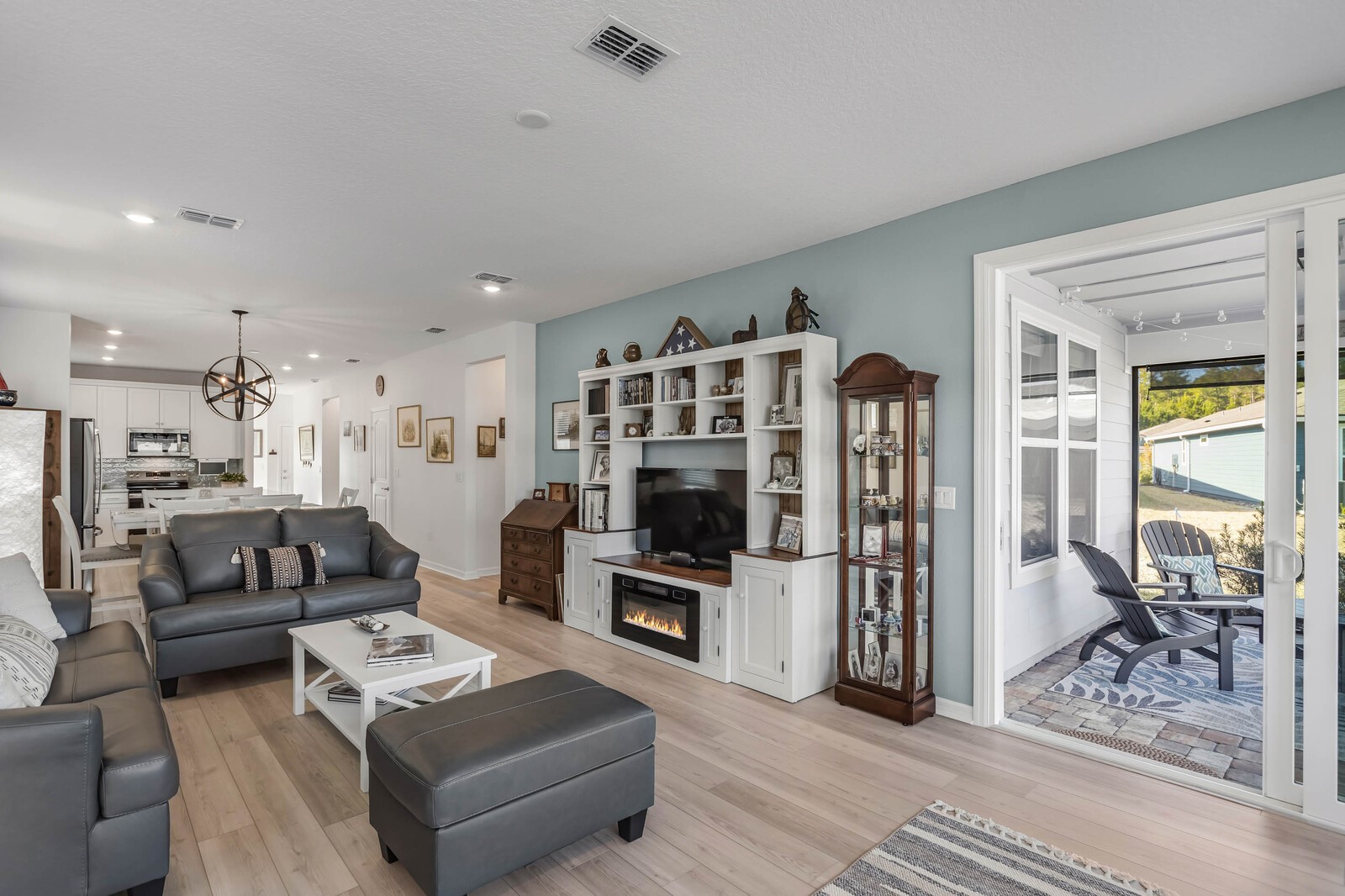 727 Cool Breeze Way Yulee, FL 32097 - Photo 8 of 31 a living room with furniture and a flat screen tv