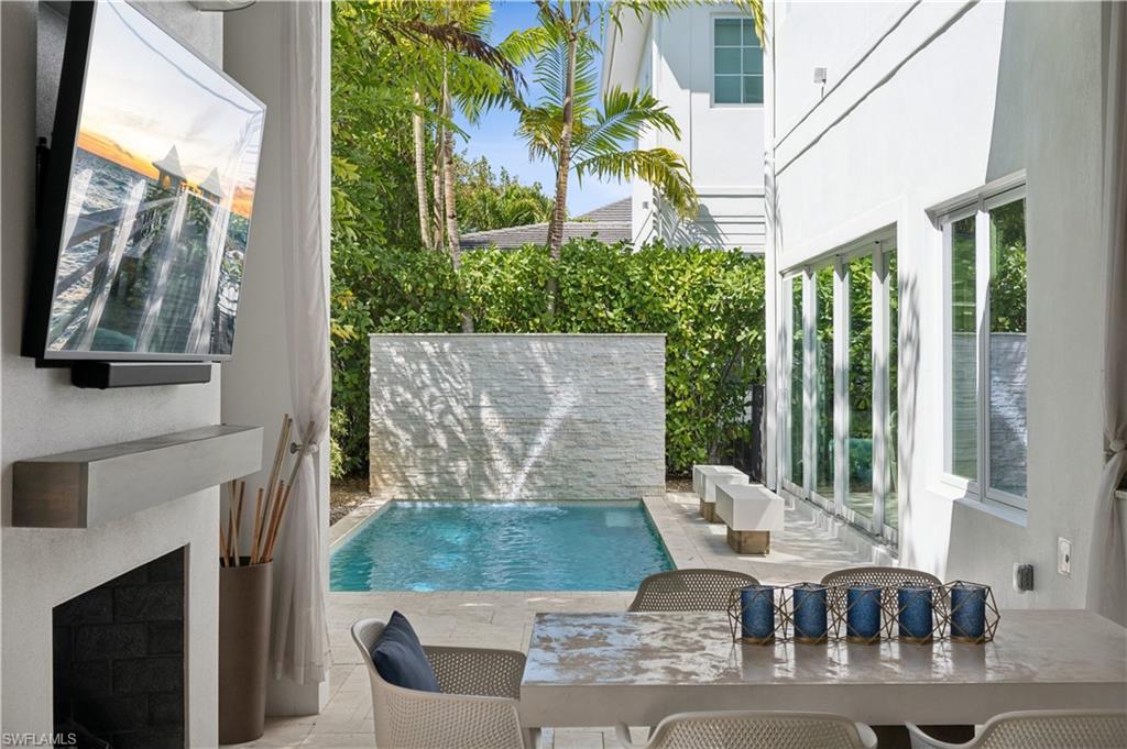 9214 Mercato Way Naples, FL 34108 - Photo 8 of 9 Outdoor Living with Gas Fireplace