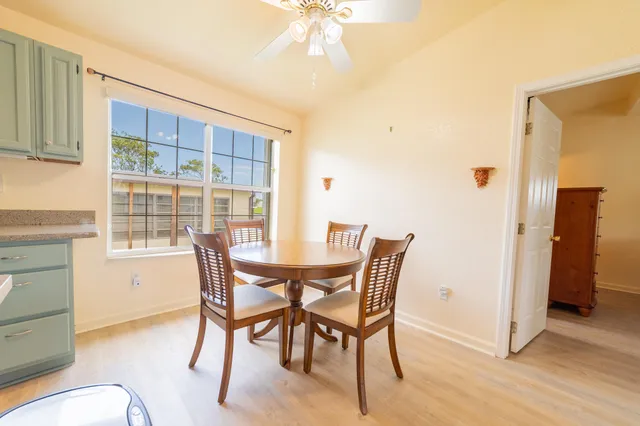 a kitchen with a stove a sink and a refrigerator