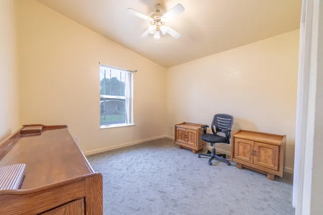 a room with a bed and a chandelier