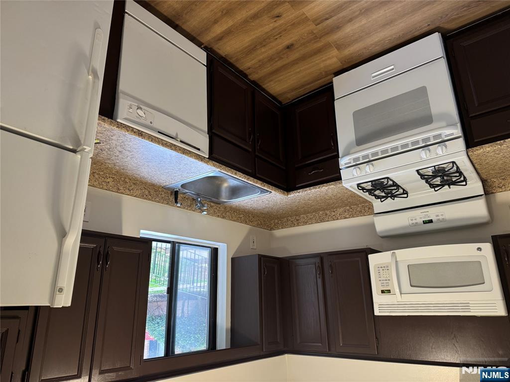a kitchen with a stove microwave and refrigerator