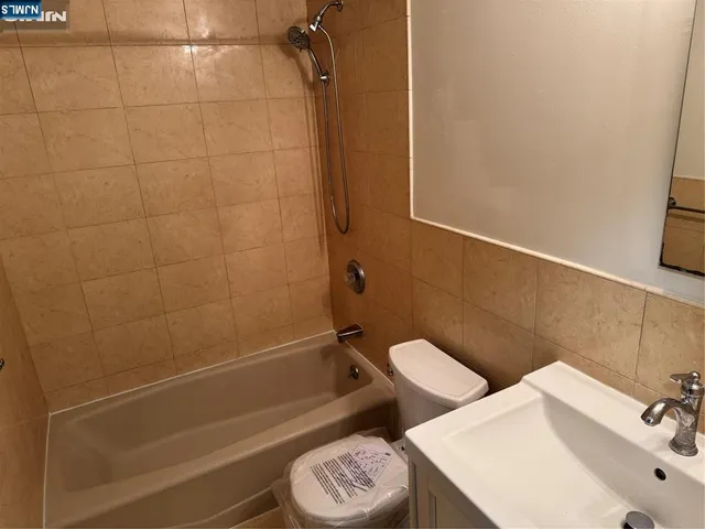 a bathroom with a sink and toilet