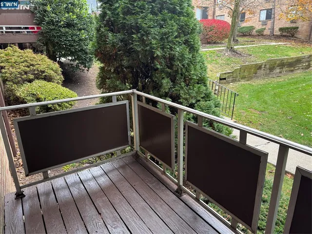 a view of balcony with a yard