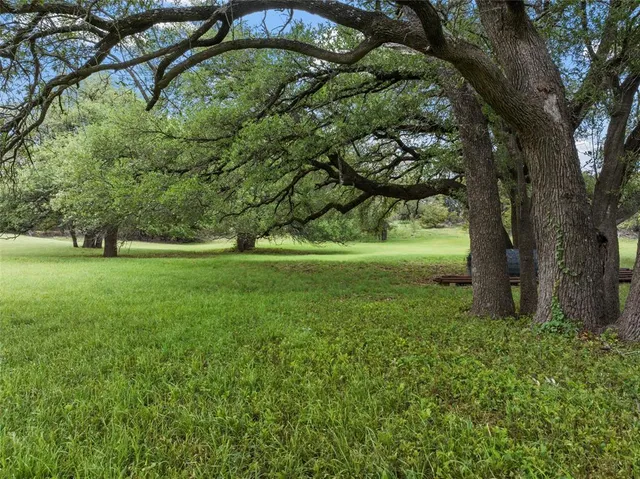 a view of outdoor space with deck and yard