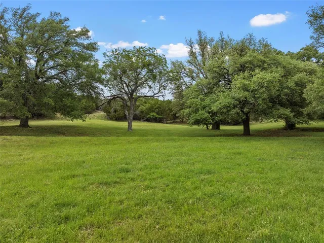 a view of outdoor space with deck and yard