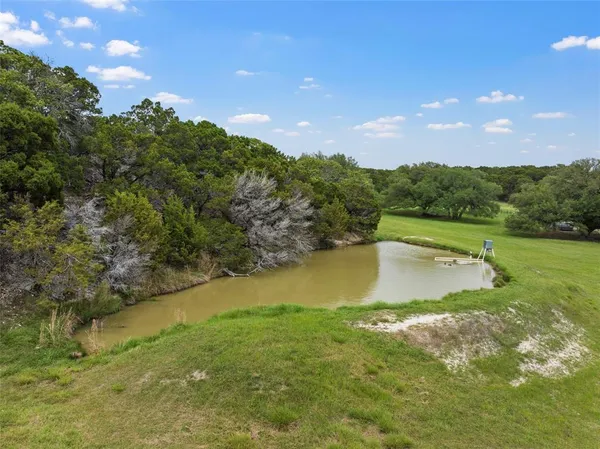 a view of a lake from a yard