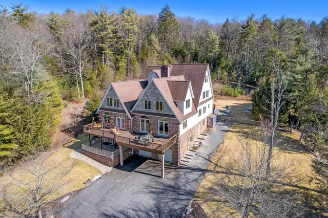 a kitchen with stainless steel appliances granite countertop a sink stove and microwave