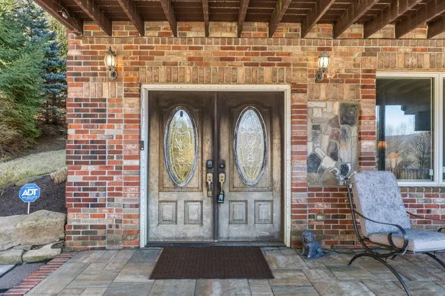 a living room with fireplace furniture and a flat screen tv