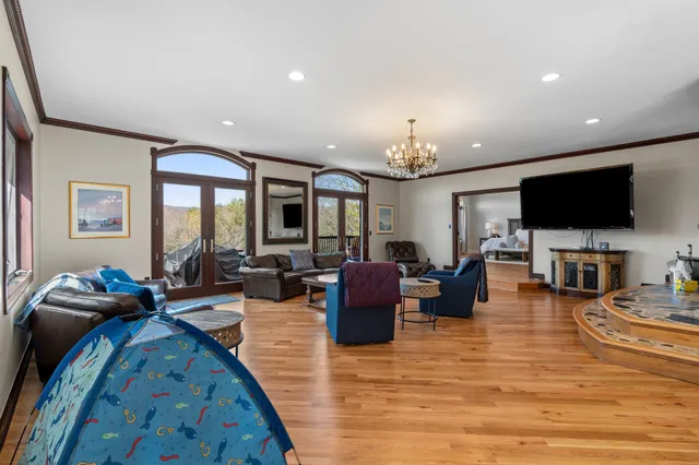 a bathroom with a granite countertop sink a toilet and shower
