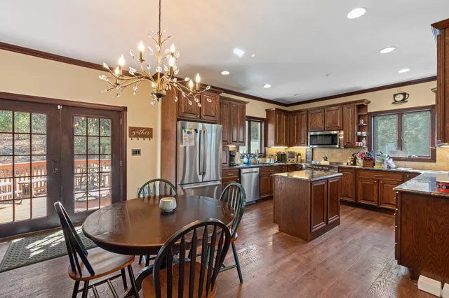 a view of a porch with furniture and floor to ceiling window
