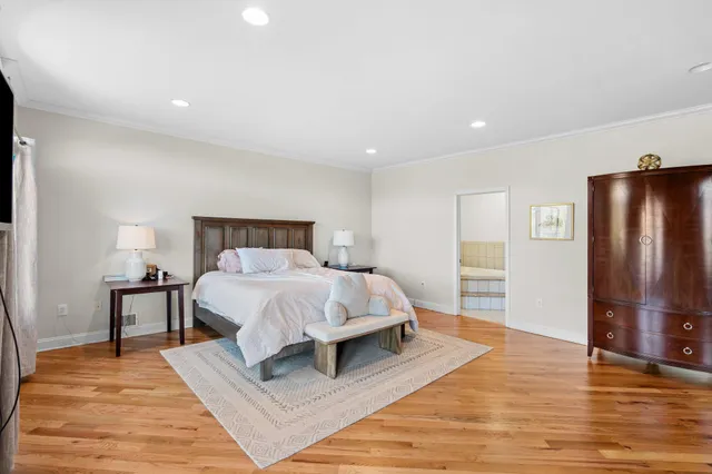 a view of a patio with table and chairs with wooden floor and fence
