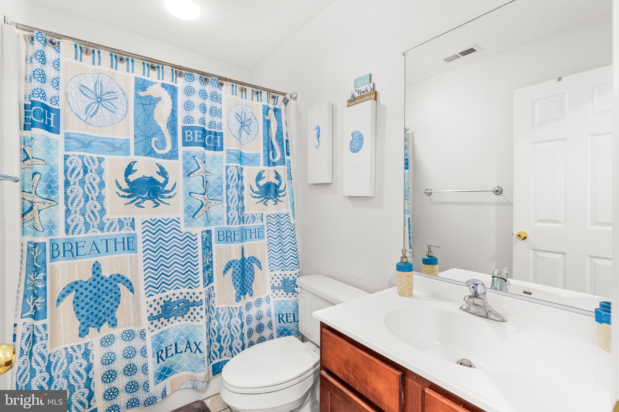 617 Salt Spray Road, Unit B Ocean City, MD 21842 - Photo 53 of 72 a bathroom with a sink toilet and shower