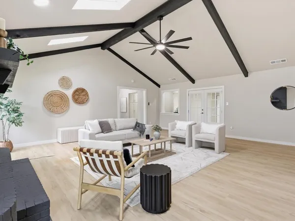 a living room with furniture and a table