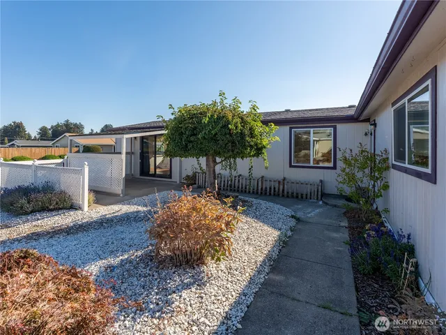 a backyard of a house with seating space