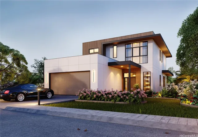 a front view of a house with a garden and plants