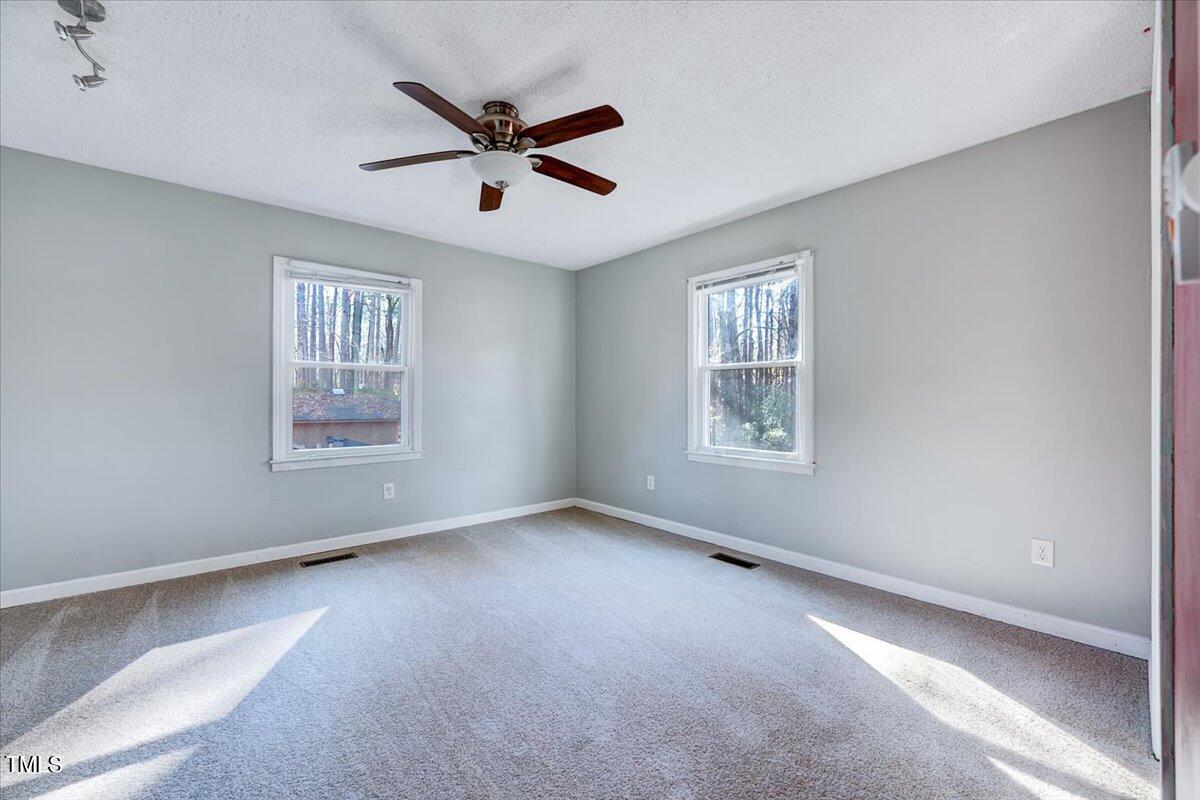 1831 Milan Street Durham, NC 27704 - Photo 13 of 38 a view of a livingroom with a ceiling fan and window