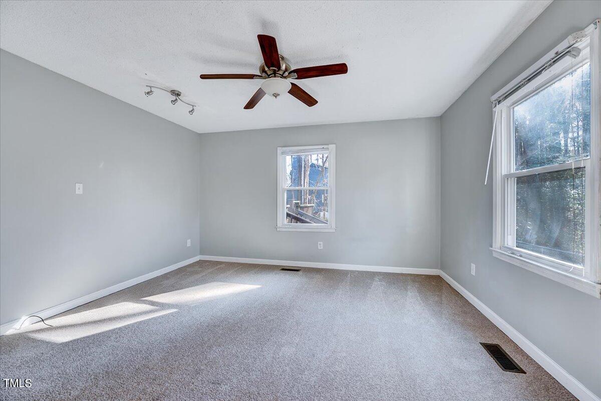 1831 Milan Street Durham, NC 27704 - Photo 15 of 38 a view of room window and ceiling fan