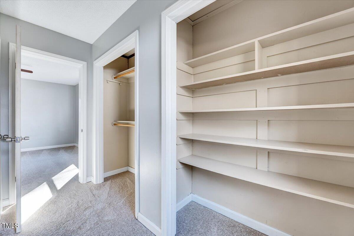 1831 Milan Street Durham, NC 27704 - Photo 16 of 38 a view of walk in closet with empty racks