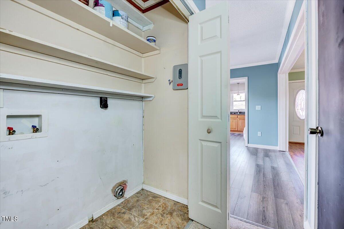 1831 Milan Street Durham, NC 27704 - Photo 19 of 38 a view of a hallway with wooden floor and closet