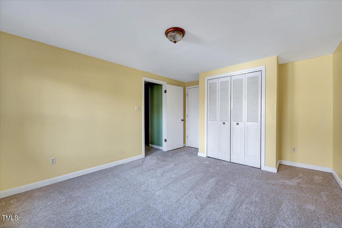 1831 Milan Street Durham, NC 27704 - Photo 21 of 38 a view of an empty room with a window
