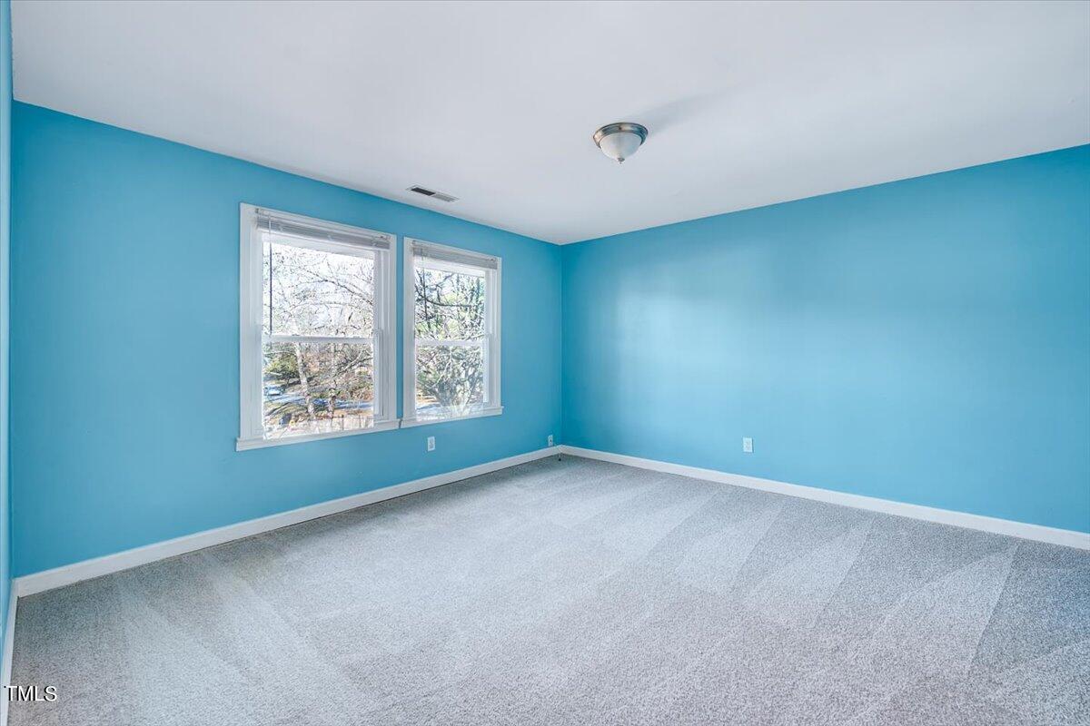 1831 Milan Street Durham, NC 27704 - Photo 24 of 38 an empty room with windows