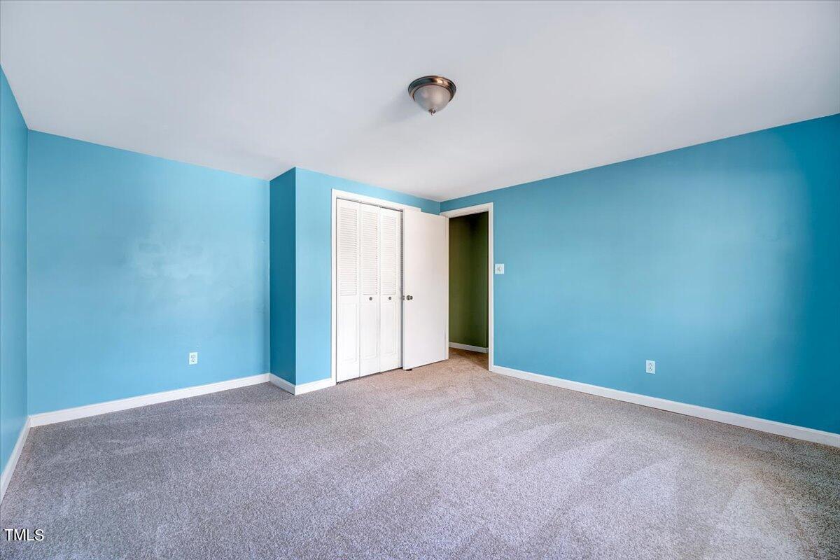 1831 Milan Street Durham, NC 27704 - Photo 26 of 38 a view of an empty room with closet and entryway