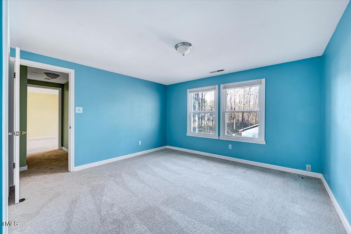 1831 Milan Street Durham, NC 27704 - Photo 27 of 38 a view of an empty room with a window
