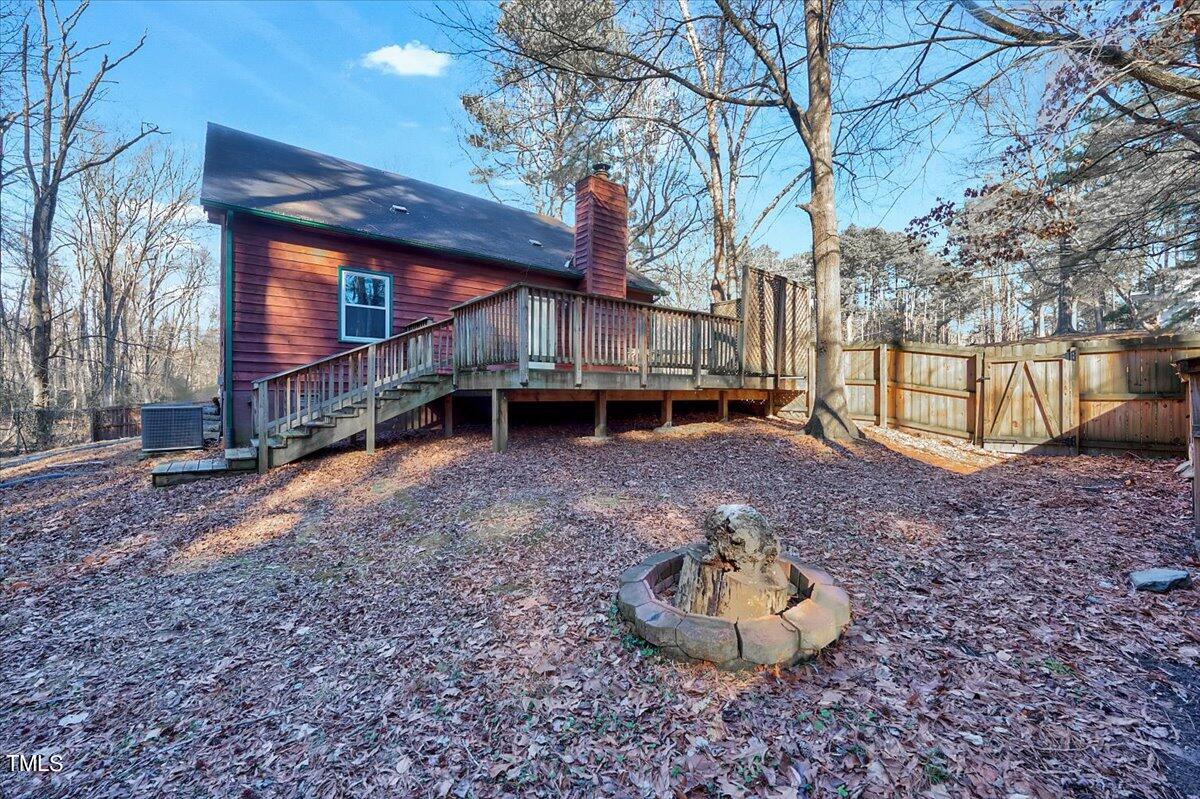 1831 Milan Street Durham, NC 27704 - Photo 29 of 38 a backyard of a house with a yard and trampoline