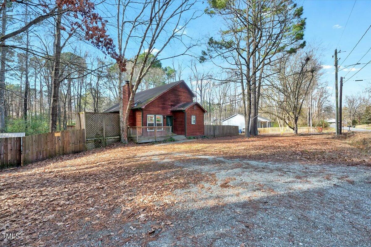 1831 Milan Street Durham, NC 27704 - Photo 3 of 38 a house with trees in front of it