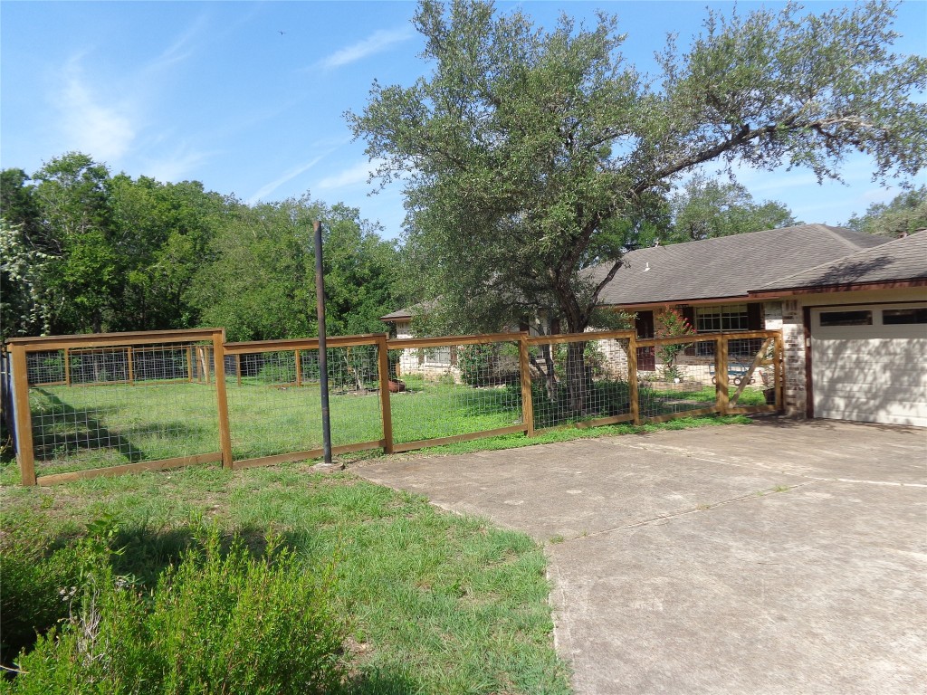 2806 Wren Road Manchaca, TX 78652 - Photo 1 of 1 a view of a house with backyard and a tree
