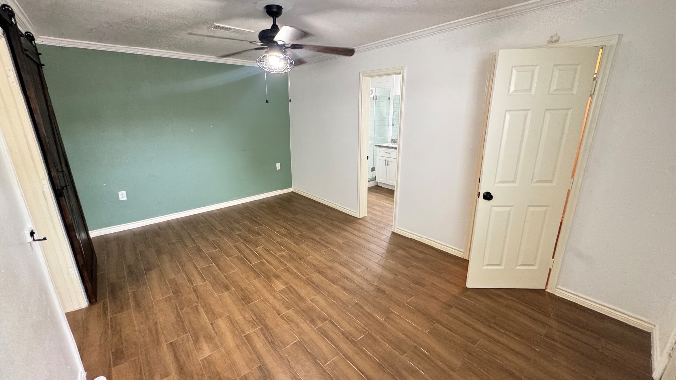 221 Hyta Street Houston, TX 77018 - Photo 12 of 35 wooden floor in an empty room with a window