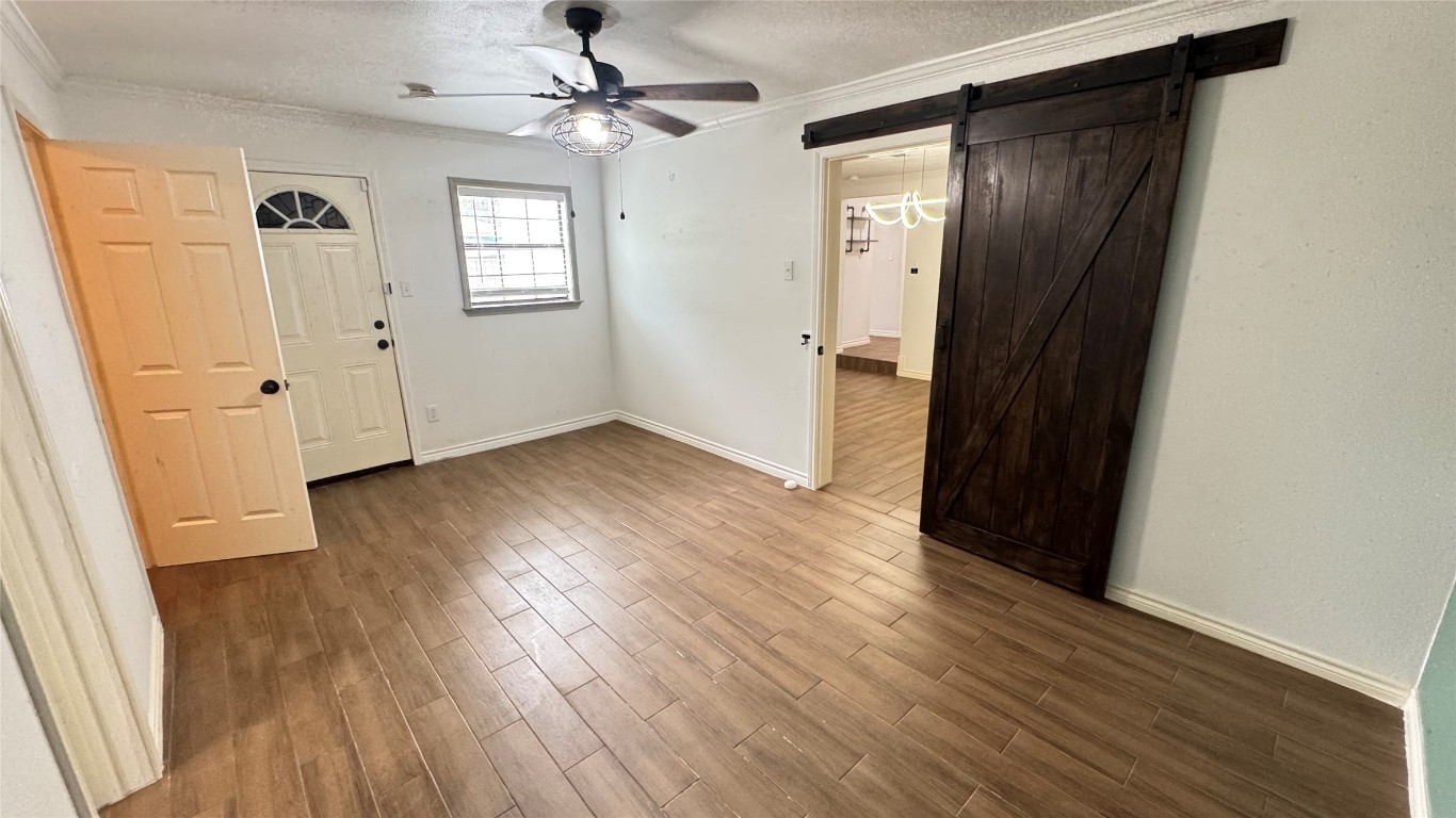 221 Hyta Street Houston, TX 77018 - Photo 13 of 35 an empty room with wooden floor and a window
