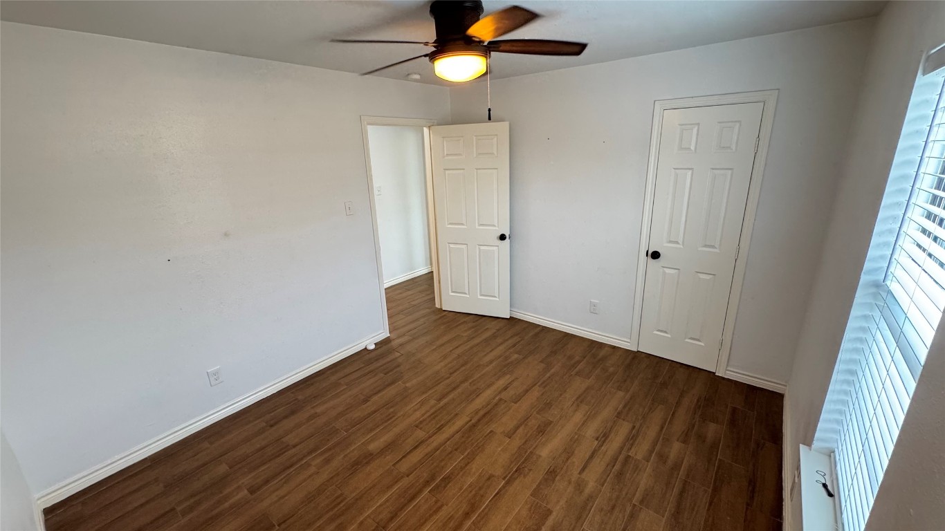 221 Hyta Street Houston, TX 77018 - Photo 19 of 35 a view of a livingroom with wooden floor and a ceiling fan