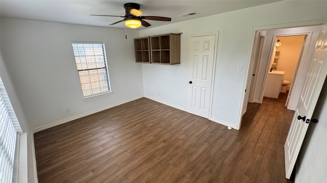 221 Hyta Street Houston, TX 77018 - Photo 20 of 35 a view of empty room with wooden floor and fan