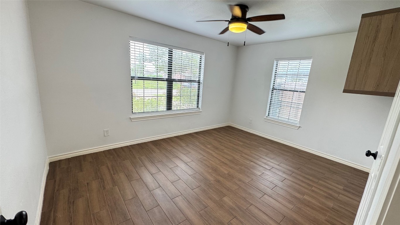 221 Hyta Street Houston, TX 77018 - Photo 21 of 35 wooden floor in an empty room with a window