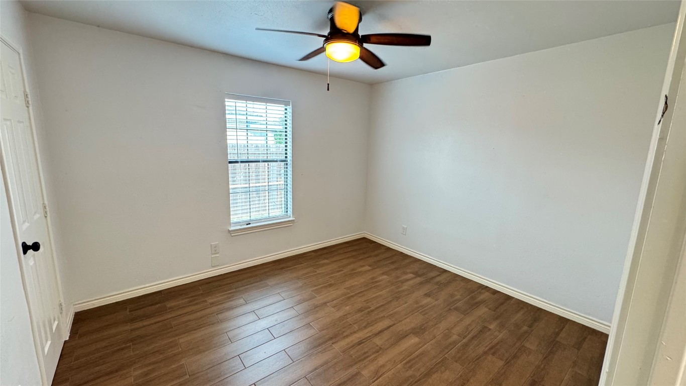 221 Hyta Street Houston, TX 77018 - Photo 22 of 35 an empty room with wooden floor ceiling fan and window