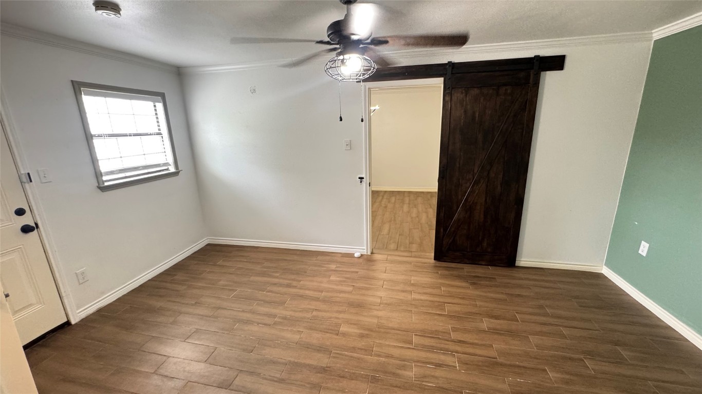 221 Hyta Street Houston, TX 77018 - Photo 26 of 35 a view of an empty room with window and chandelier fan