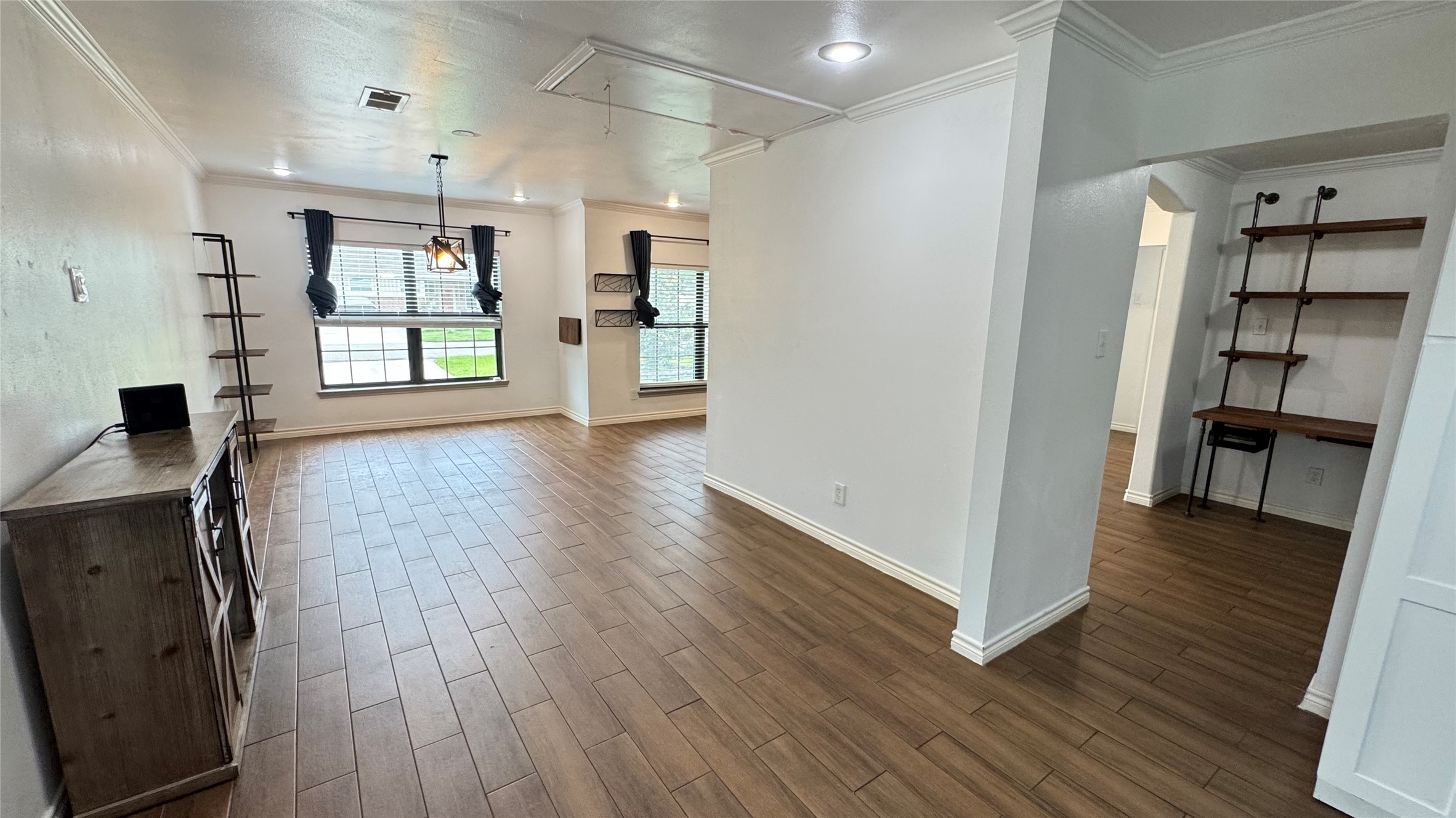 221 Hyta Street Houston, TX 77018 - Photo 10 of 35 an empty room with wooden floor and windows