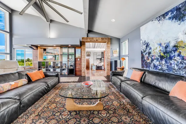a living room with furniture and a rug