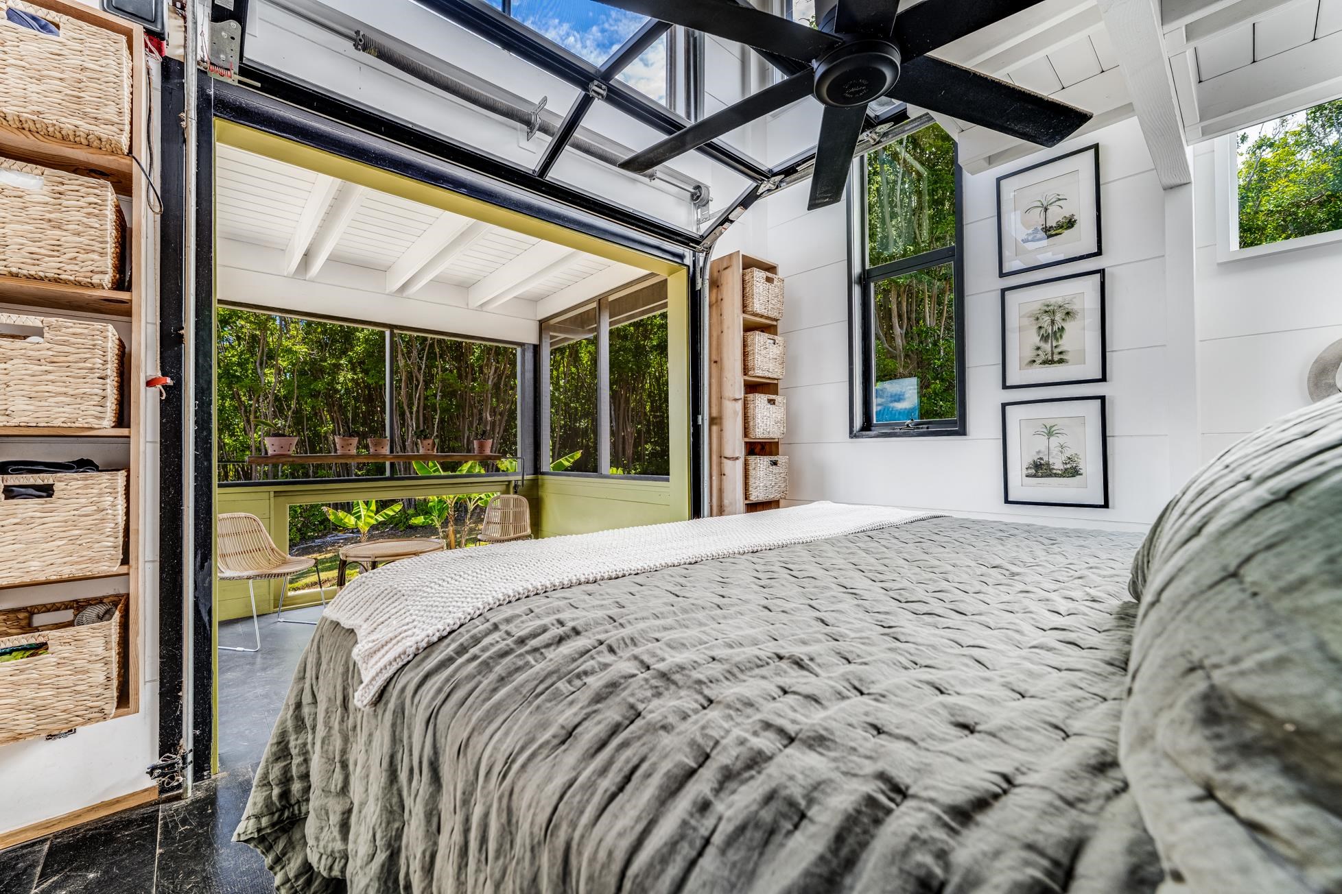 796 Awalau Road Haiku, HI 96708 - Photo 18 of 50 a bedroom with a bed and a large window