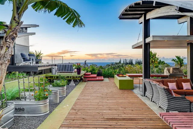 a view of a chairs and table in patio