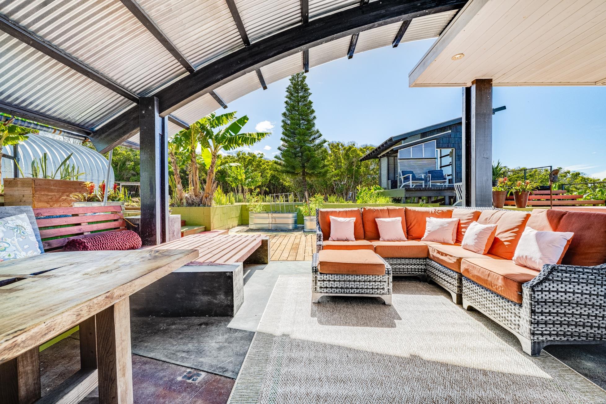 796 Awalau Road Haiku, HI 96708 - Photo 30 of 50 a outdoor space with patio couches and a fireplace