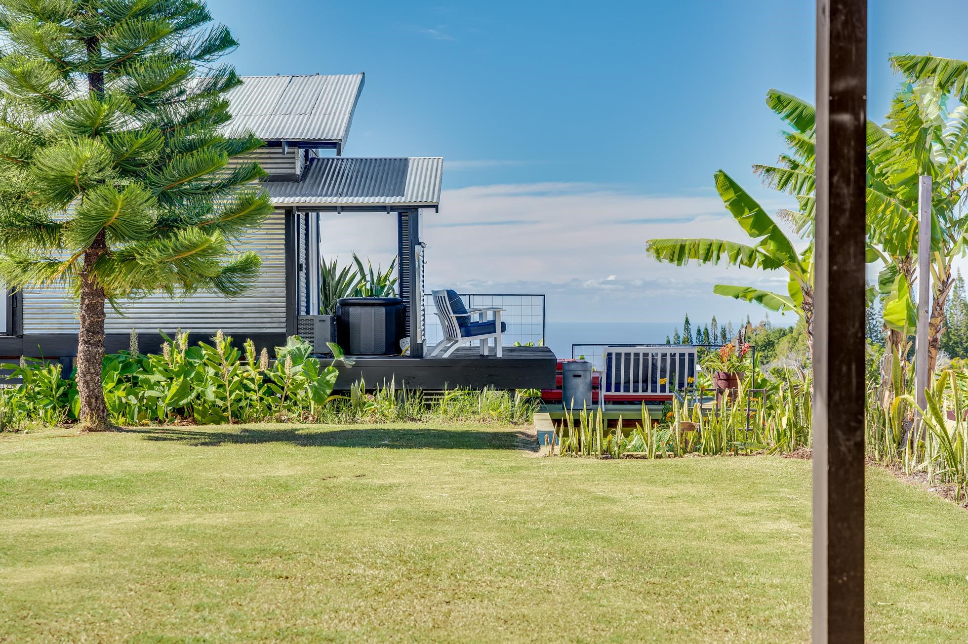 796 Awalau Road Haiku, HI 96708 - Photo 34 of 50 a house with garden in front of it