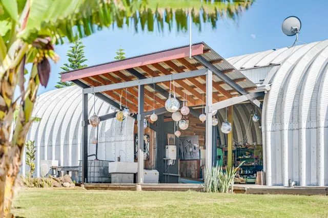 a view of an chairs and table in the balcony