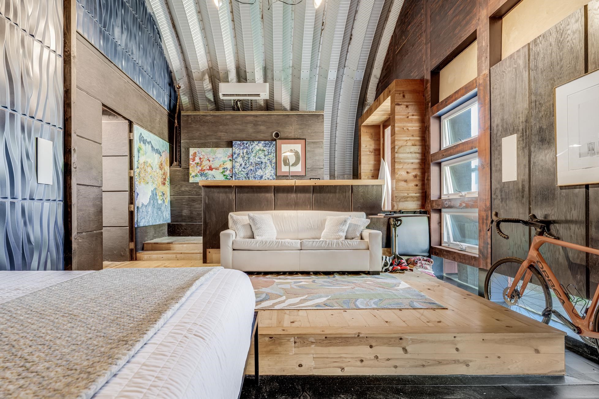 796 Awalau Road Haiku, HI 96708 - Photo 38 of 50 a bedroom with a bed and large windows