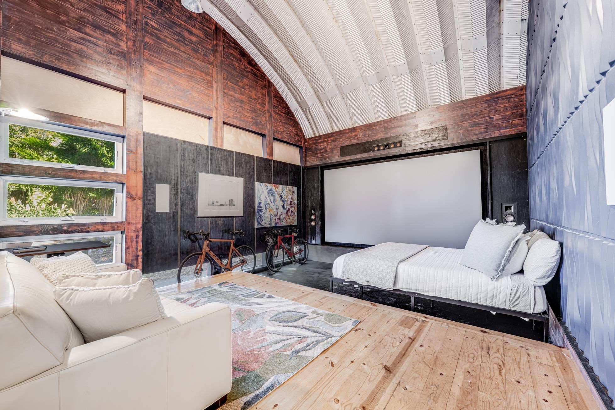 796 Awalau Road Haiku, HI 96708 - Photo 39 of 50 a living room with furniture and a large window