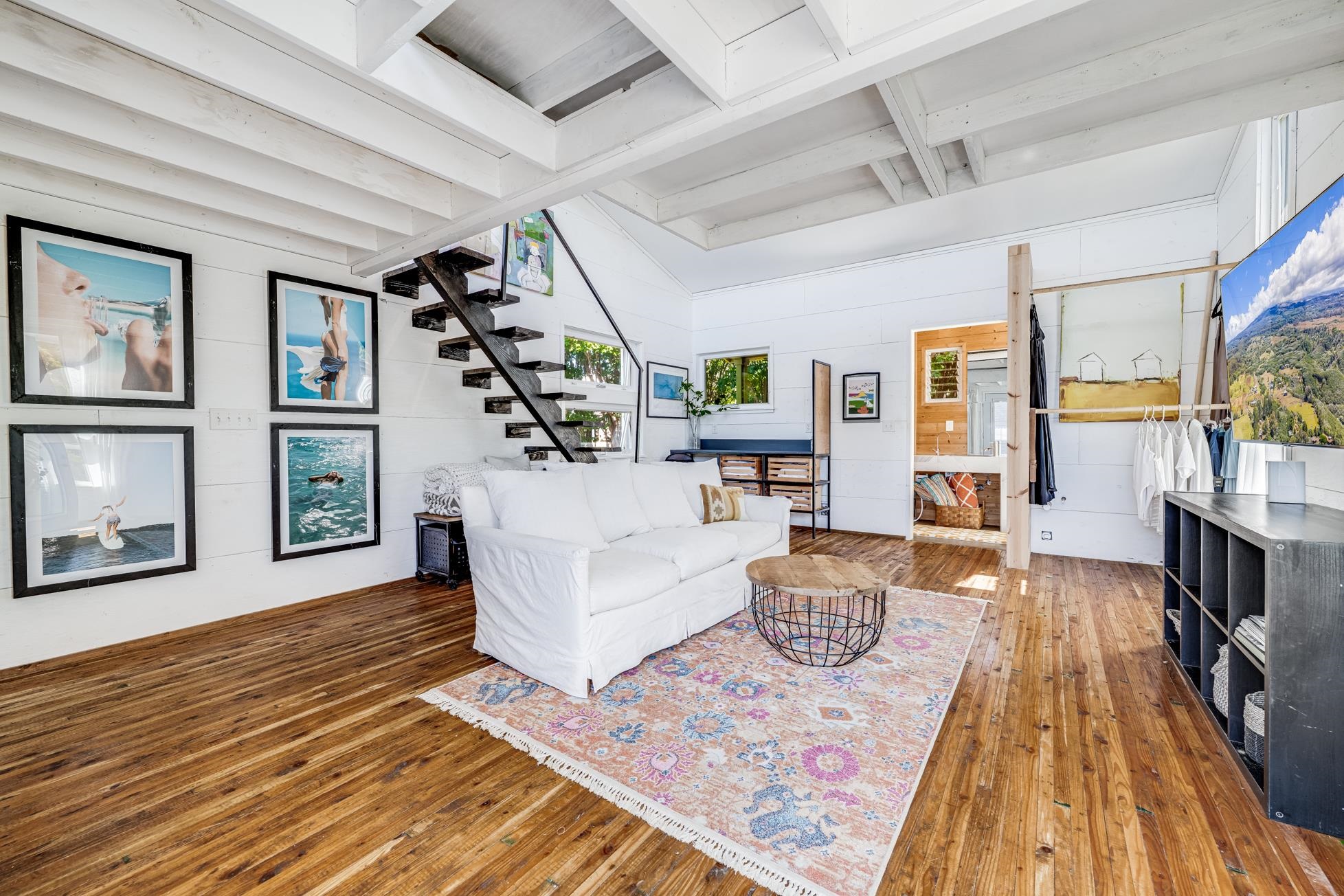 796 Awalau Road Haiku, HI 96708 - Photo 43 of 50 a living room with furniture and a wooden floor